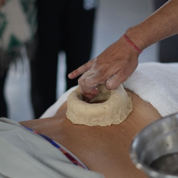 Traditional Kati Basti, an Ayurvedic oil therapy